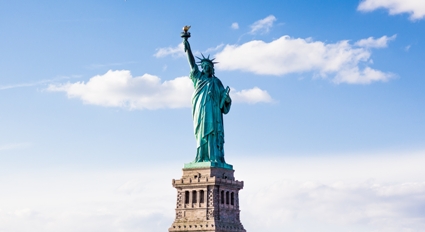 The Statue of Liberty with a cloudy beautiful sky in the background